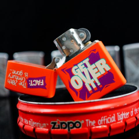 Zippo màu Cam nhẹ chữ Get Over sản xuất 1999